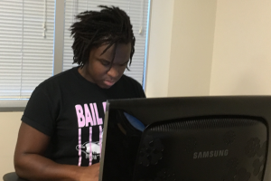 OLS Student working on computer