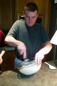 OLS Student cooks at Sizzleworks