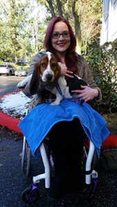 Mallorie holds basset hound Dewey Howls