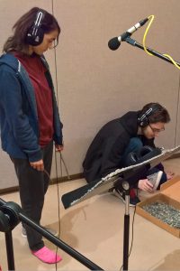 Students recording sound of shoes walking on gravel