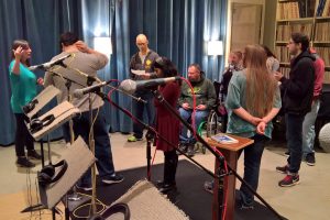 Students working on a project at a recording studio