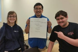 Students work together in class on a group activity