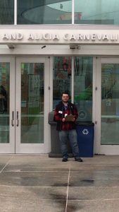 Nigel stands in front of the Pacific Science Center 