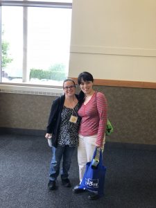 Ky and Susan pose for a photo in front of a window at the Wentachee Convention Center