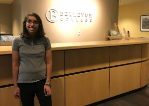 Acacia poses in front of the North campus front desk