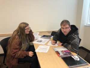 Tashi and TJ work together on an assessment in class. 