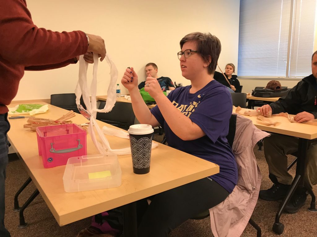 Student is shown how to create plarn