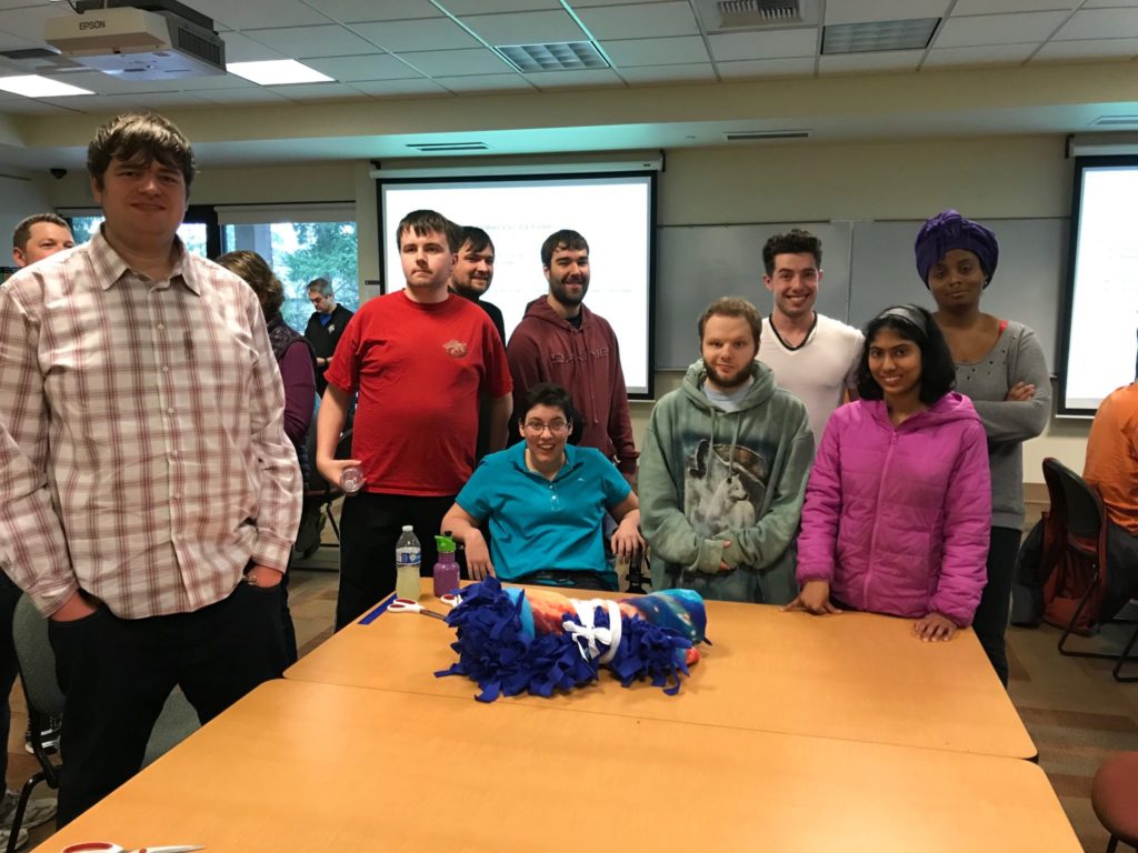 group of 9 students with completed blankets
