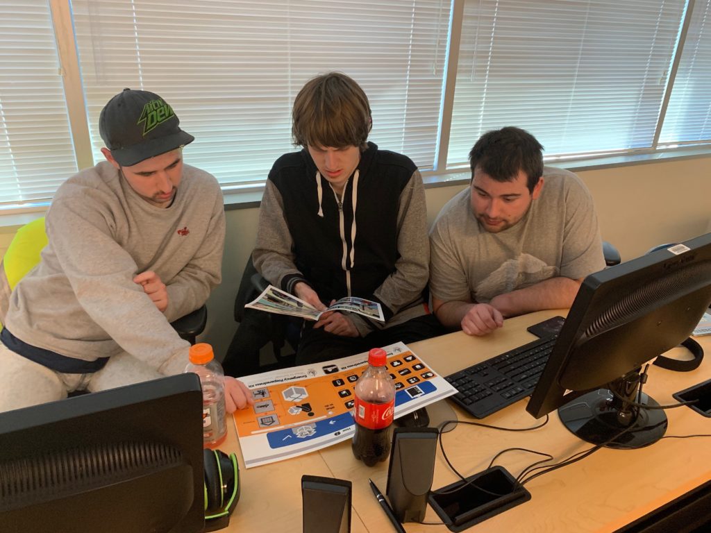 3 male students work together