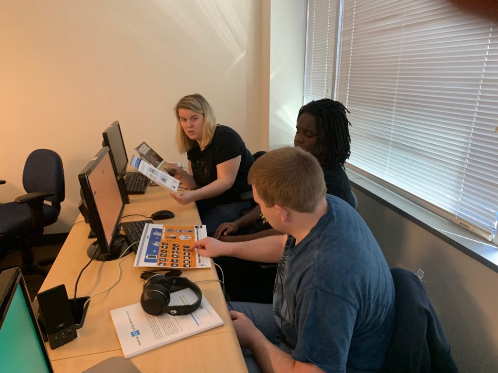 three students work together