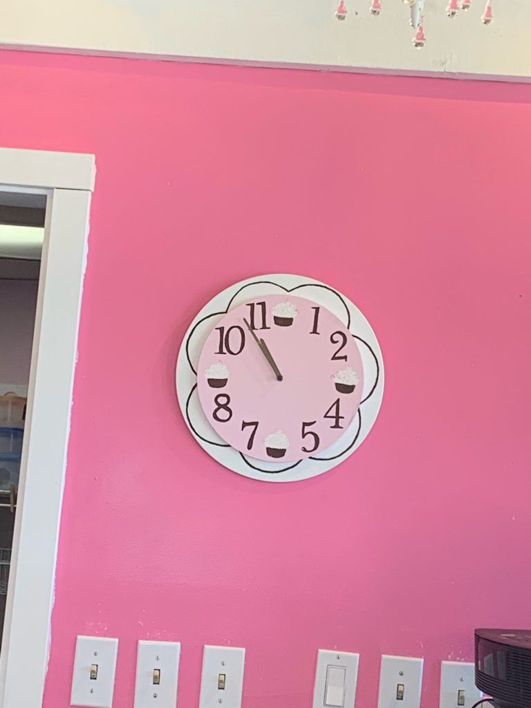 cupcake store clock with cupcakes at 12, 3, 6, 9