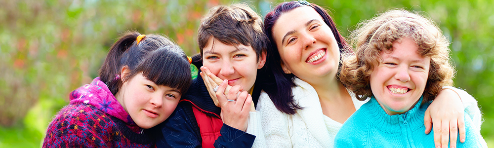 group of happy women with disability having fun in spring park