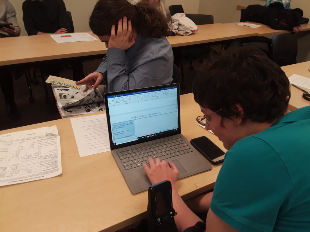 a student reviews information on a laptop