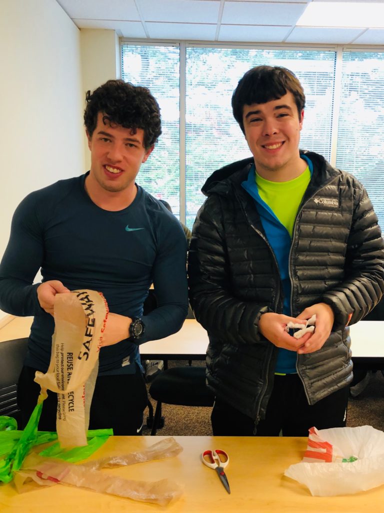 students work on making plarn out of plastic bags