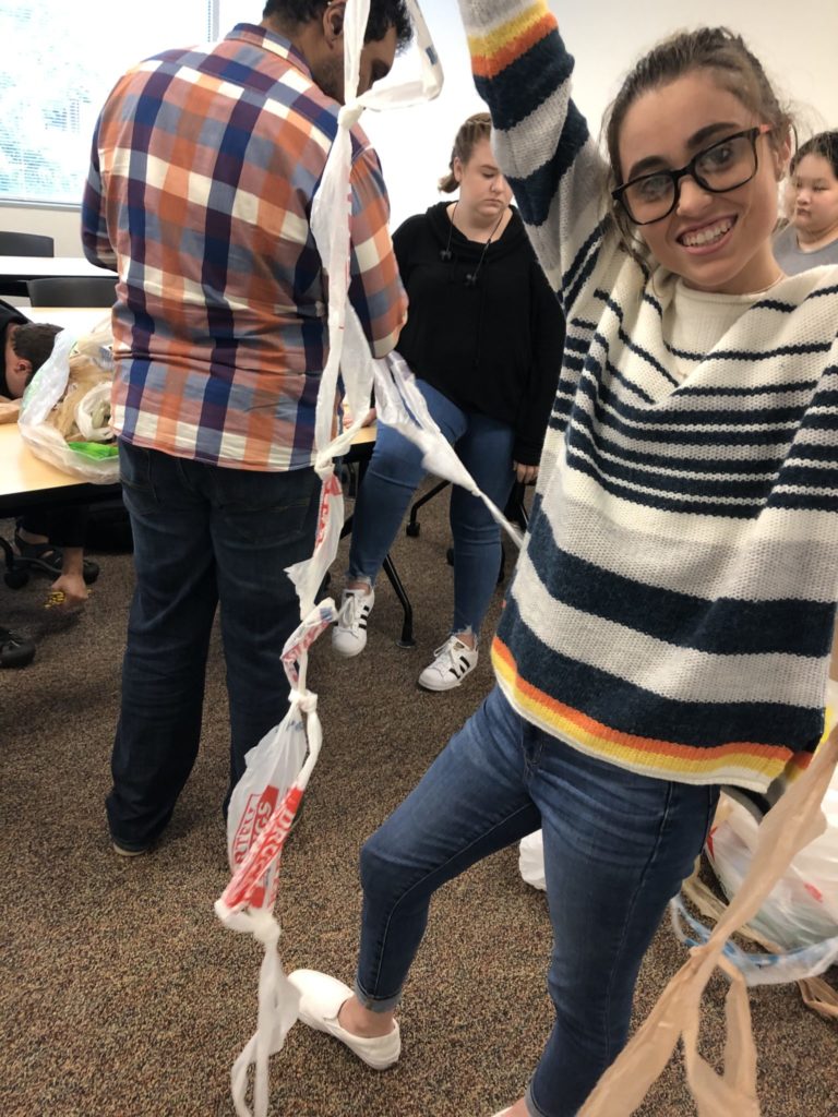 students work on making plarn out of plastic bags