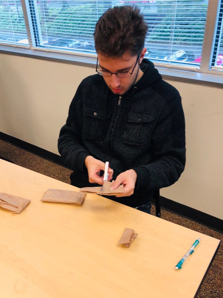 students work on making plarn out of plastic bags