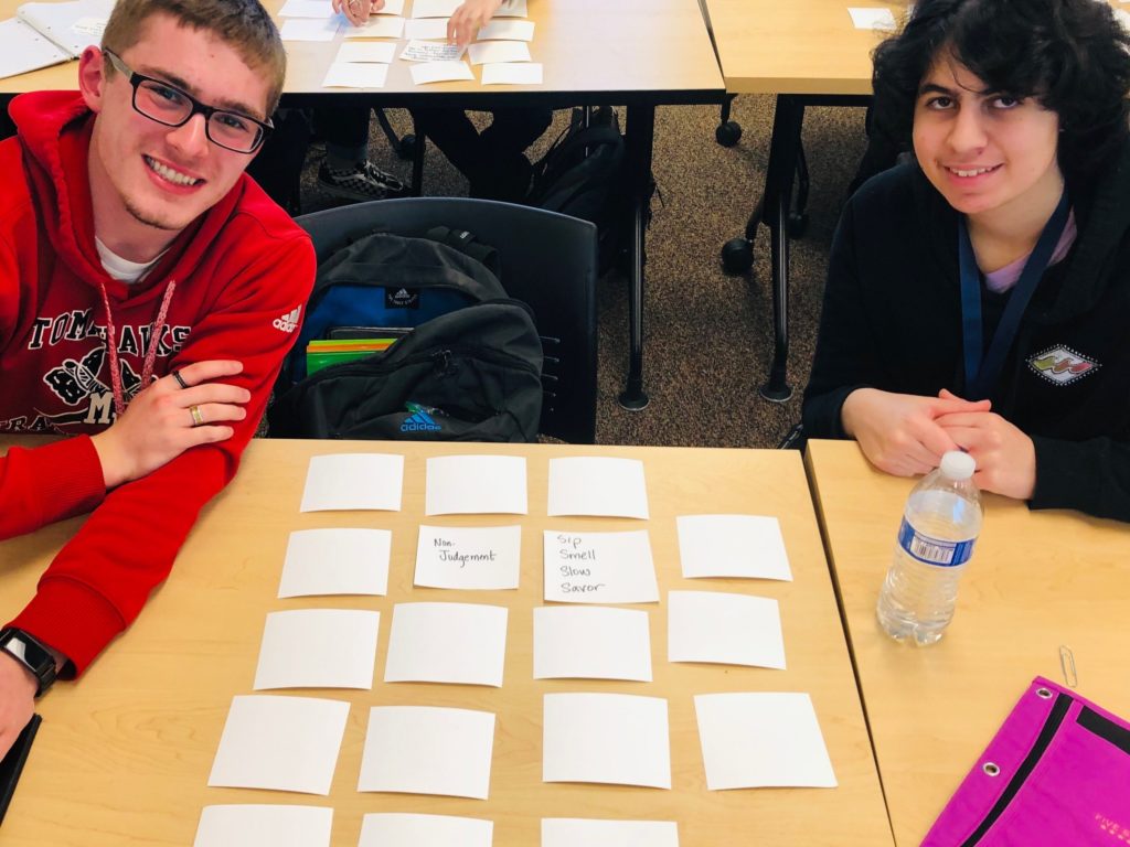 two young adult students play a memory game