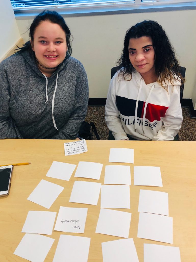 two young adult students play a memory game