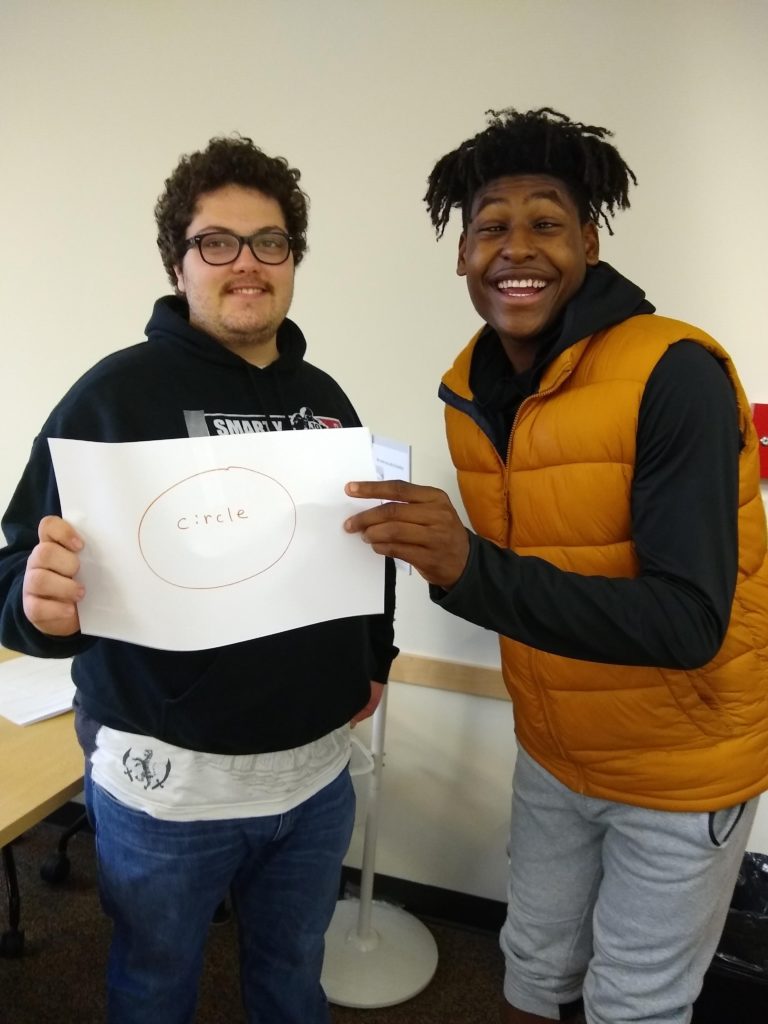 two students in college classroom