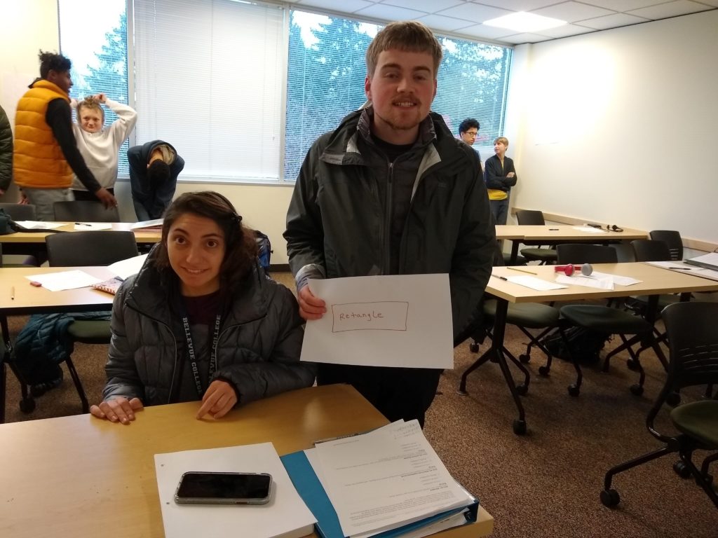 two students in college classroom