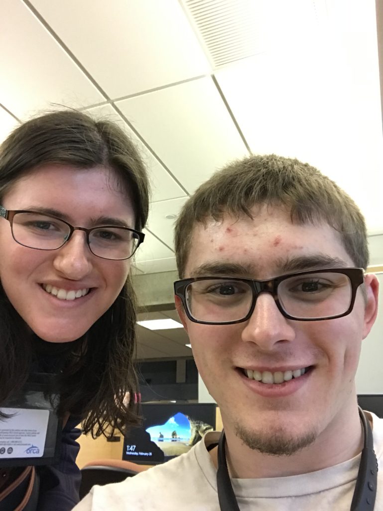 selfie of young man and young woman on college campus