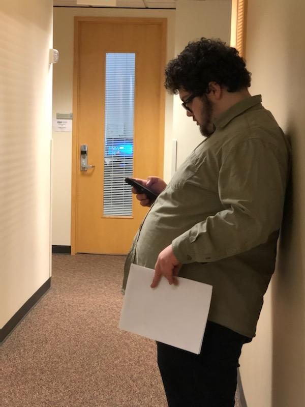 a young man prepares for a job interview