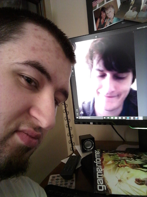 selfie photo of a young man meeting with a friend on the computer