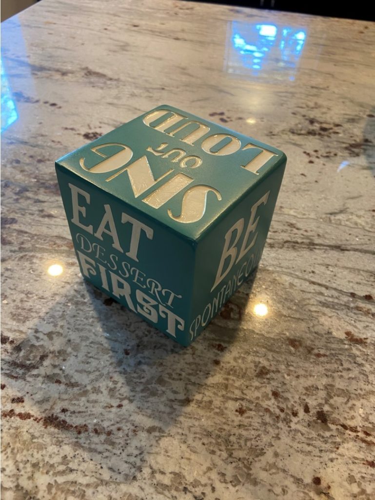 6-sided dice with words on sides instead of dots