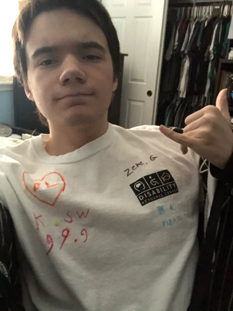 selfie of OLS student wearing their disablity pride t-shirt