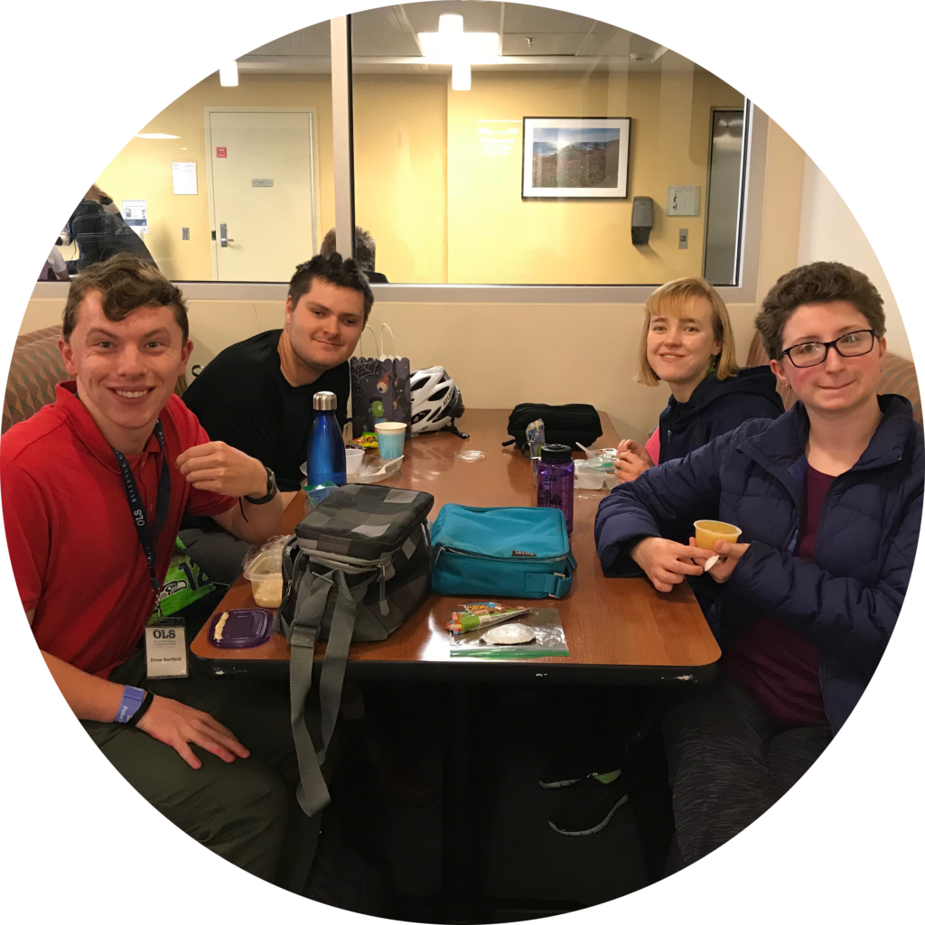 four OLS students eat lunch together on campus