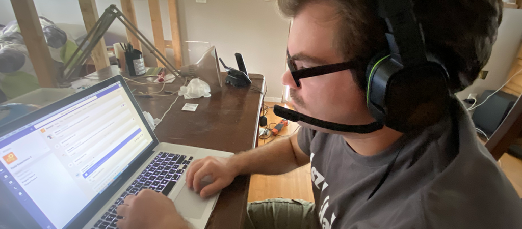 OLS Student working on computer from their home