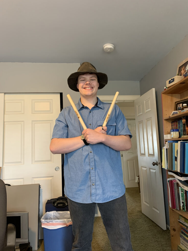 OLS Student holds up taicho drum sticks