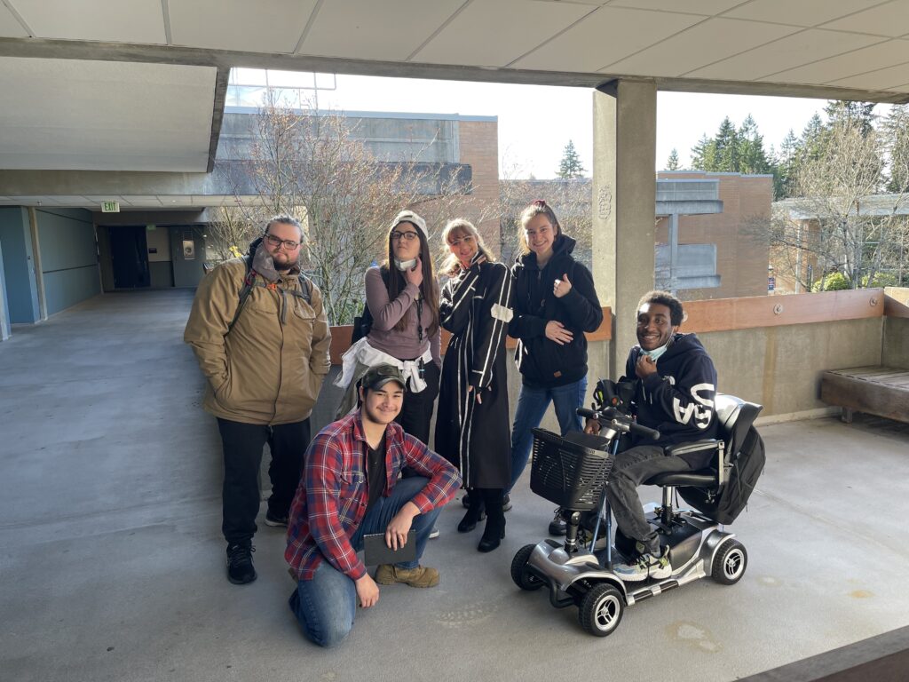 Group of 6 OLS students pose for a photo on campus