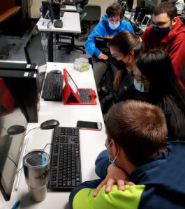 OLS Students working on a group project on campus. 