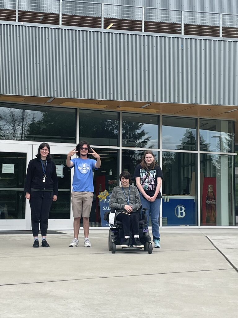 Four OLS students pose outside the Bellevue College dorms.