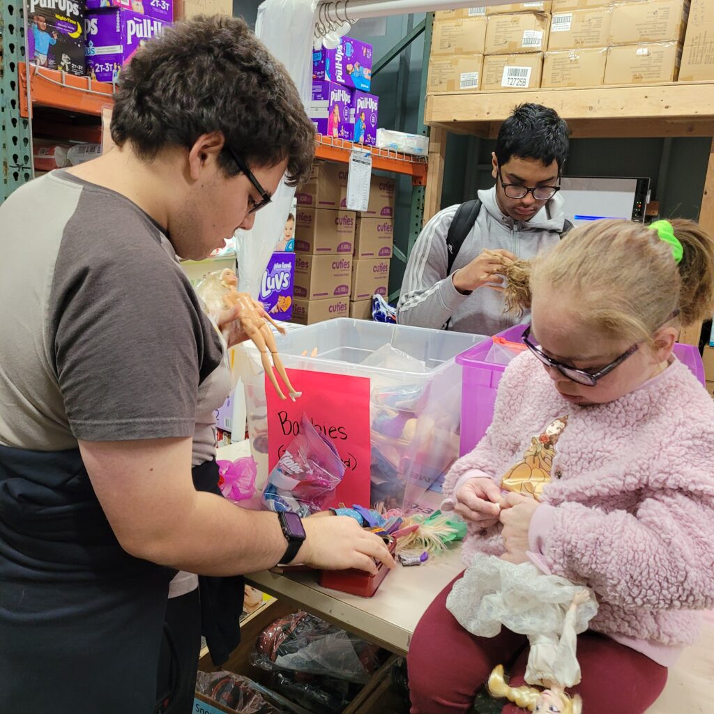 a group of OLS students volunteer at a charity organization