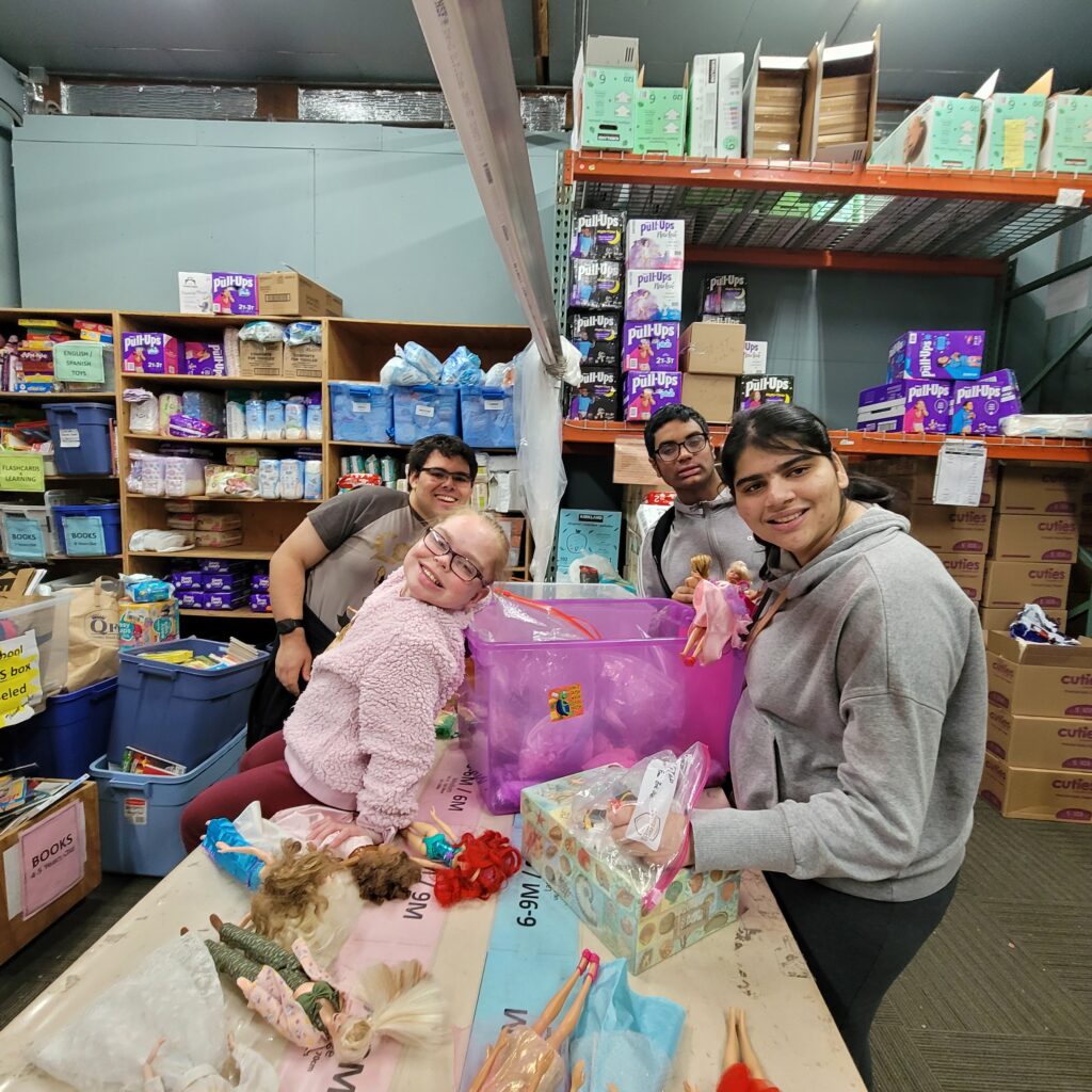 a group of OLS students volunteer at a charity organization