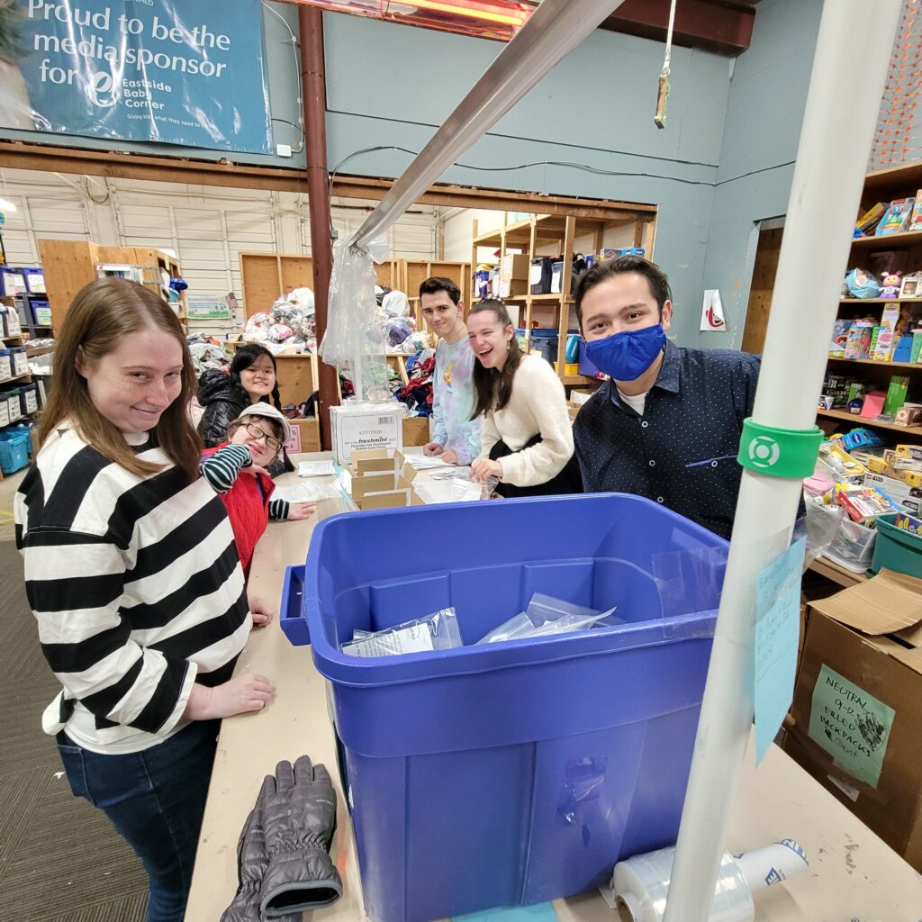 a group of OLS students volunteer at a charity organization