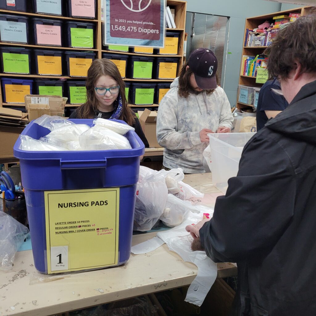 a group of OLS students volunteer at a charity organization