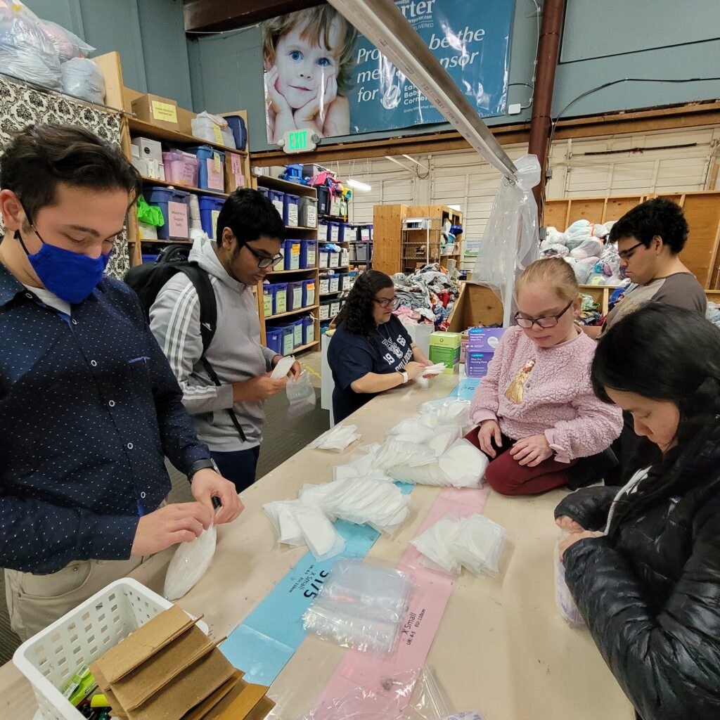 a group of OLS students volunteer at a charity organization