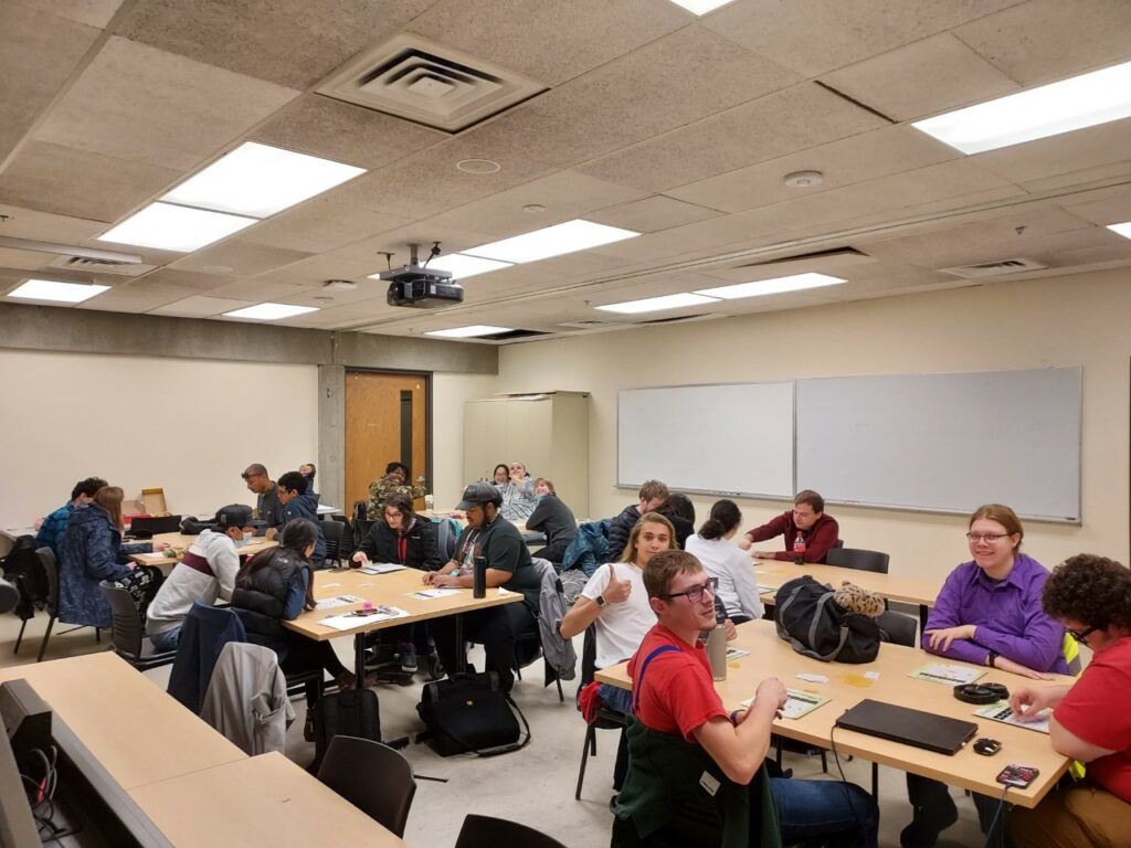 Large group of OLS students playing bingo in class