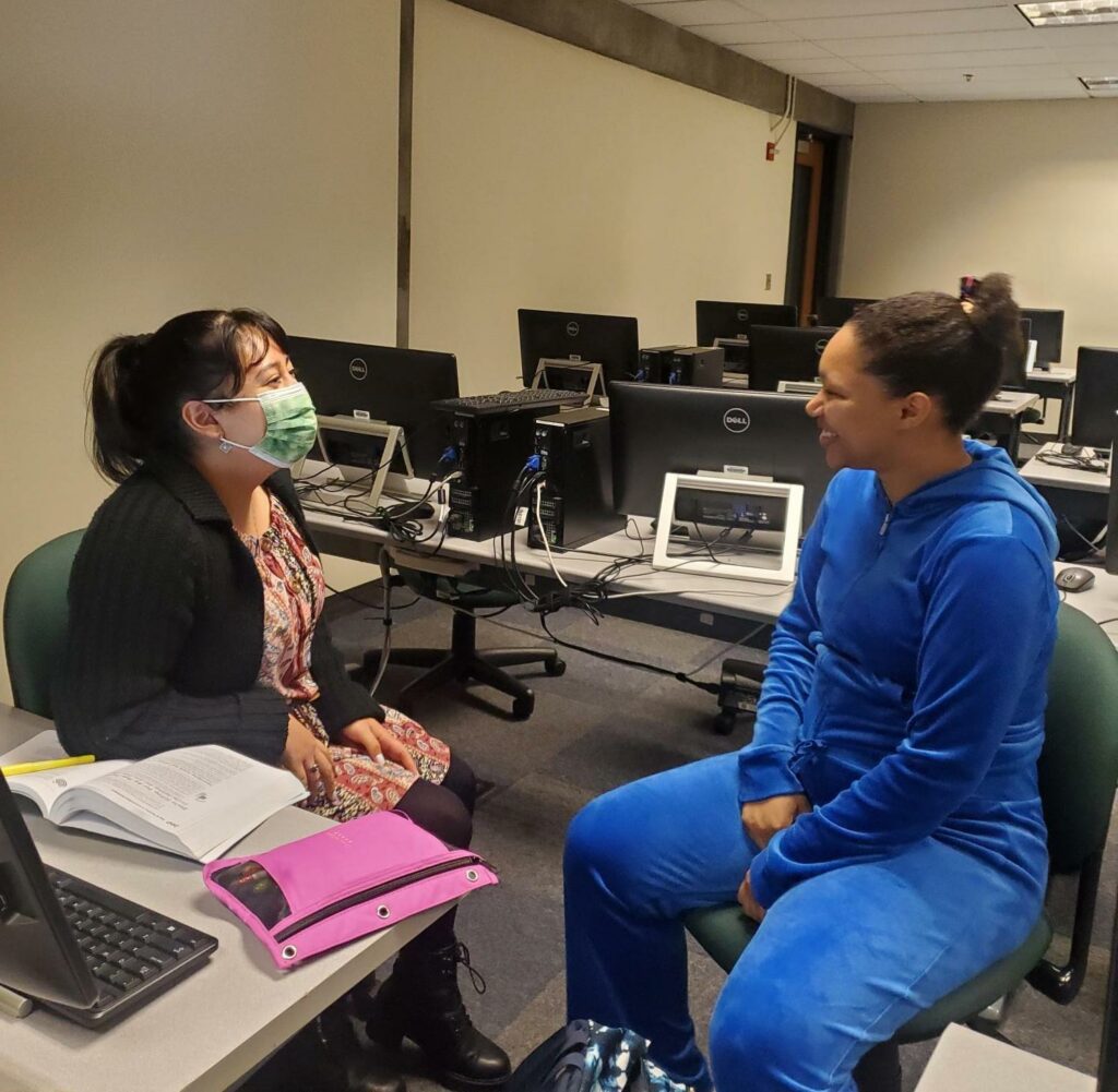 Two OLSBC students practice for mock interviews