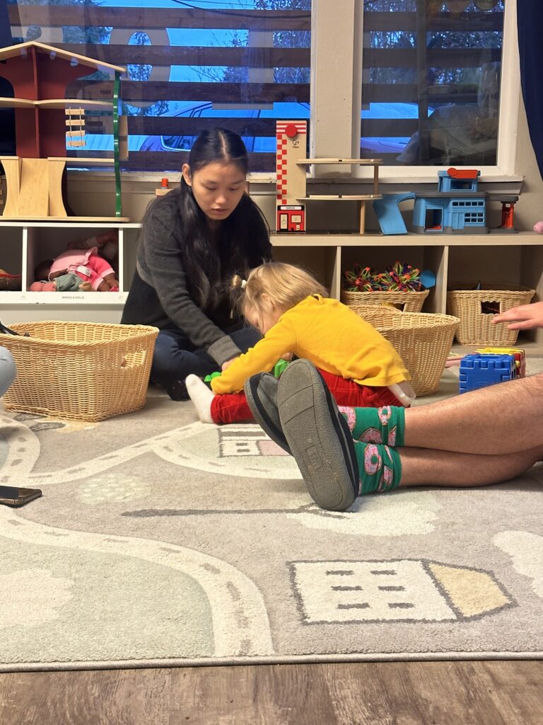 OLS student works with a young child at a daycare center