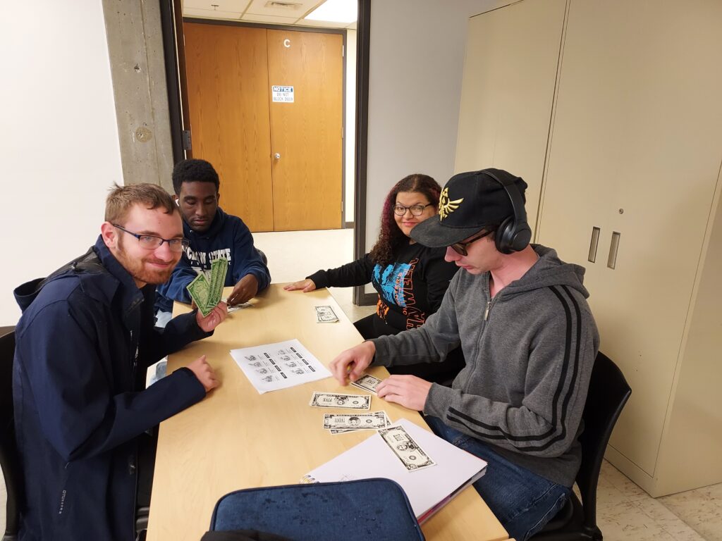 A group of OLS students practice personal finance