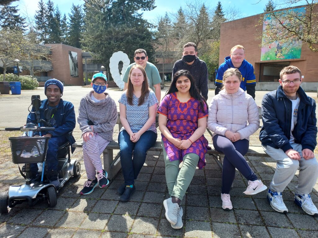 A group of OLS Bellevue College students pose for a group picture on the Bellevue College campus. 