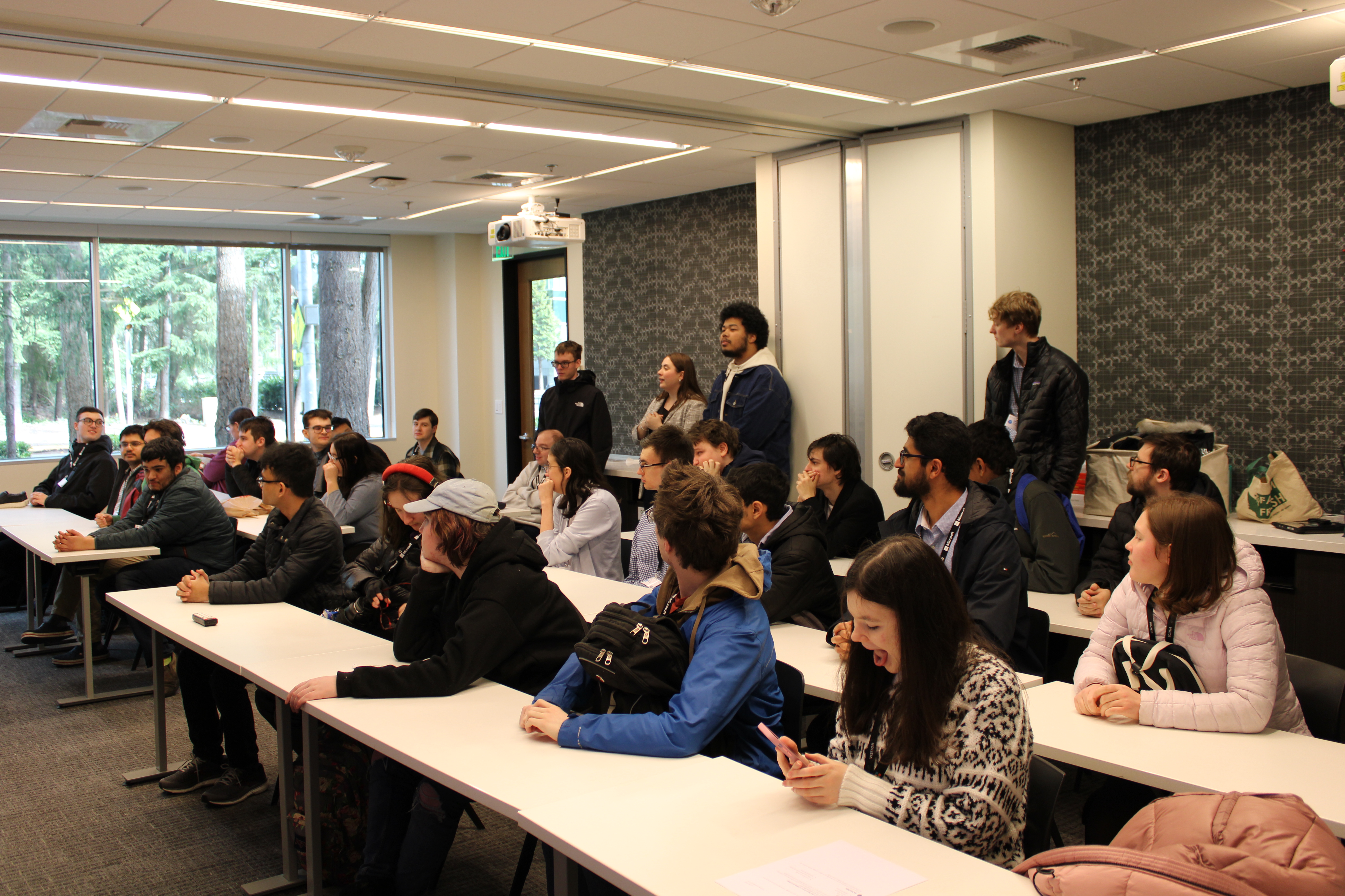 OLS Bellevue College students getting feedback on their mock interviews from Microsoft employees