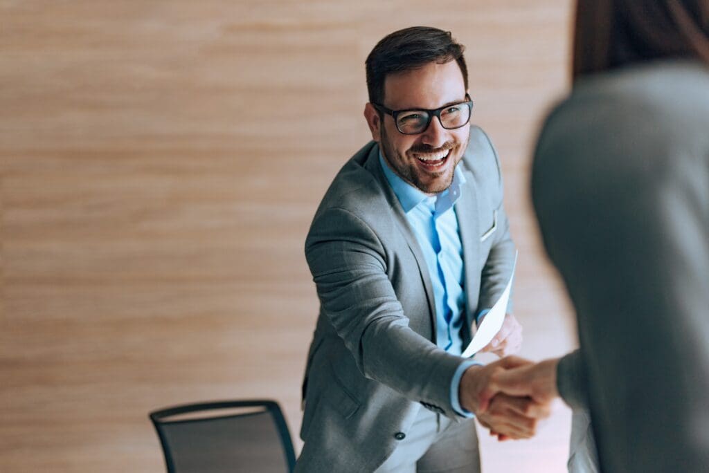 male shaking hands with someone