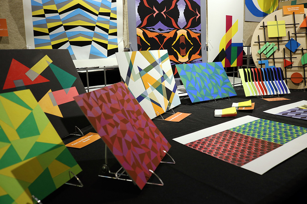 A display of colorful paintings.