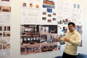 A student presents their work at a showcase.