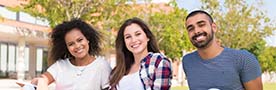 Students sitting on the grass at school campus